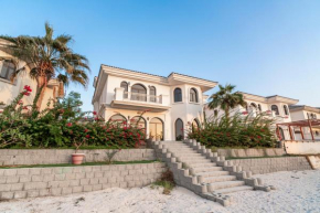 Escape 24 Luxury 5BR Villa with Private pool and Beach access in Palm Jumeirah Frond F